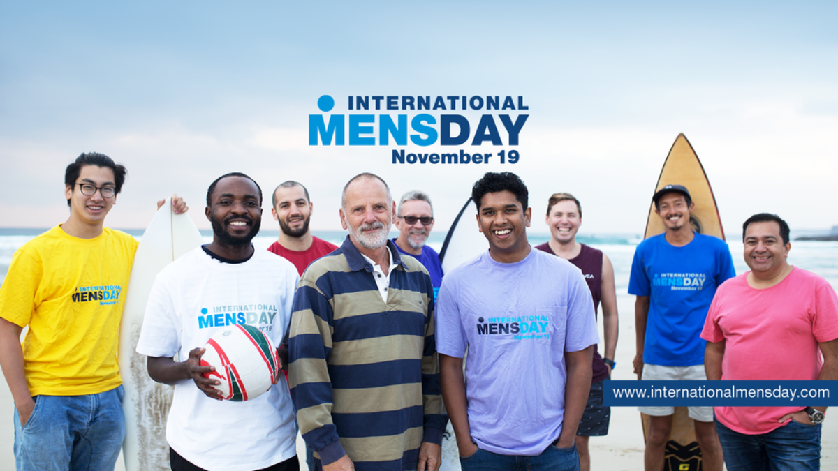 Image of a group of men standing together. The title of the image is 'International Men's Day - 19th November'.
